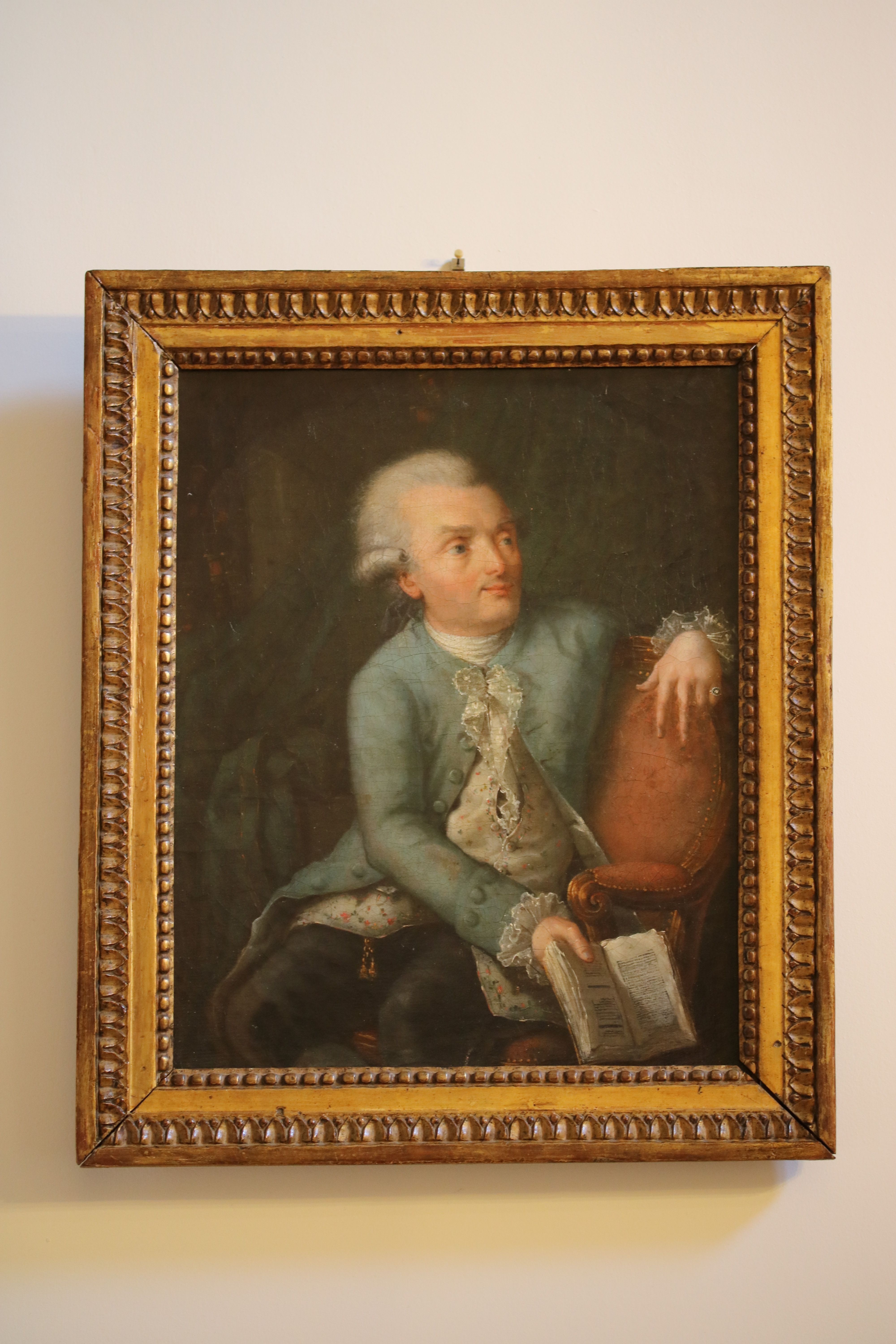 Portrait d’homme assis dans sa bibliothèque